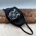 a-black-face-mask-with-a-victory-or-valhalla-design